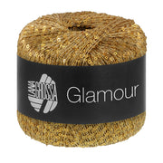 Lana Grossa Glamour 019 Goud bol pailletgaren gefotografeerd tegen een neutrale achtergrond